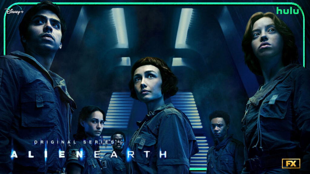 Promotional poster for the sci-fi original series Alien Earth, featuring the main Alien Earth cast standing in a dimly lit futuristic corridor. The group is dressed in dark blue, military-style uniforms with patches on their sleeves, looking alert and tense. The central female character has short dark hair with bangs, flanked by other diverse cast members, each with a serious or concerned expression. Blue neon lights and shadows create a mysterious, suspenseful atmosphere. Logos for Disney+, Hulu, and FX appear in the corners.